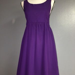 Purple dress with gold embellishment.